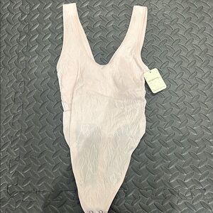 Free people light pink bodysuit new with tag